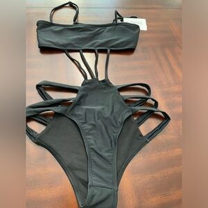 Brazilian women’s one piece black swimsuit size medium.
